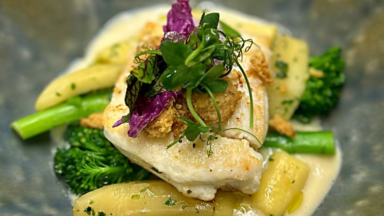 Halibut with gnocchi, stewed apple & walnut crumble on celery beurre blanc, &copy; Hakan Aybar-Steiner