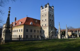 Renaissance Greillenstein Castle with tower and garden in the foreground.