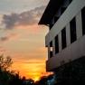 Exterior view of the hotel with sunset