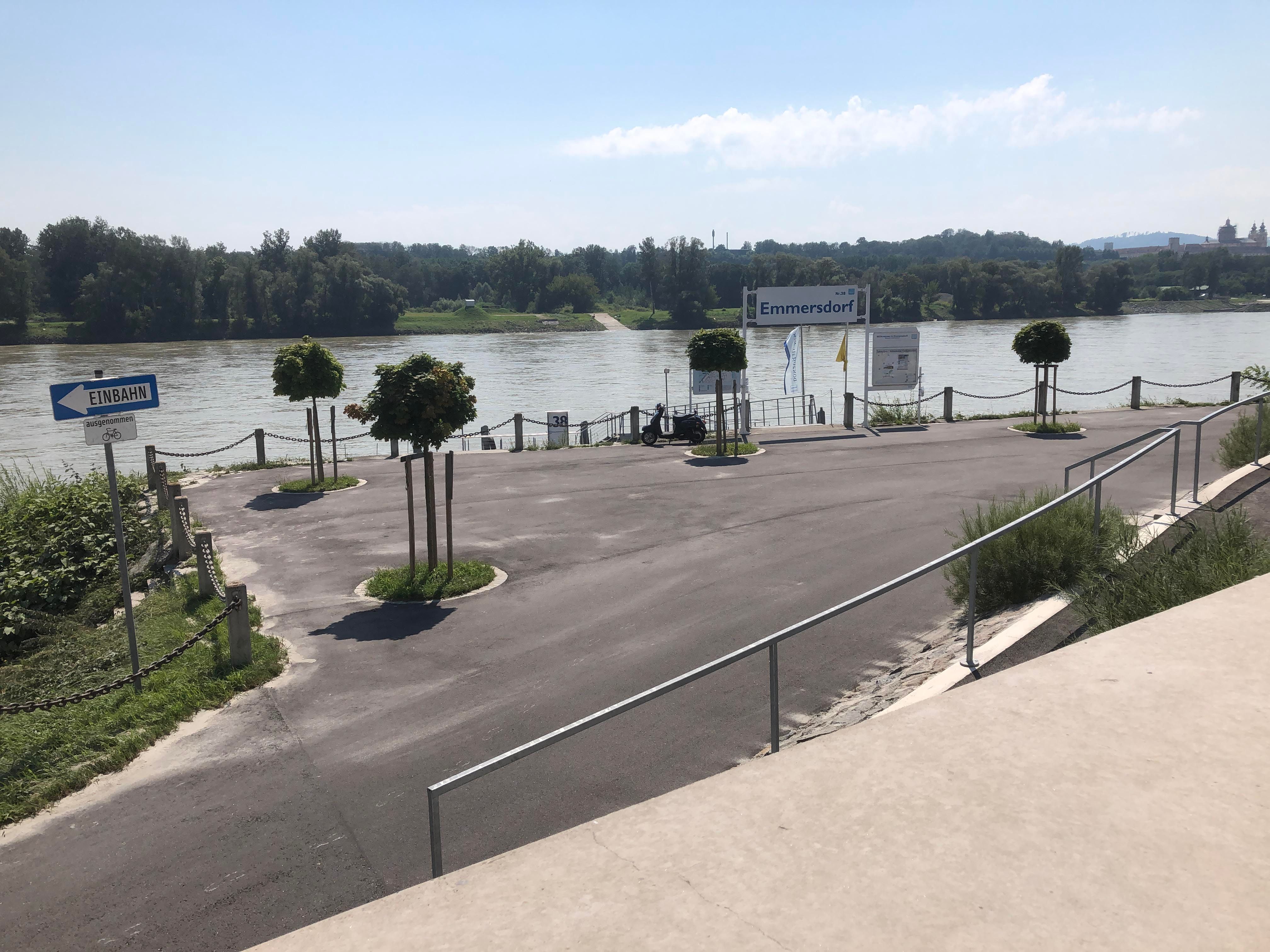 Emmersdorf landing stage with river and trees in the background.