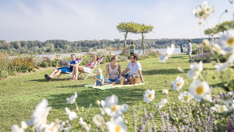 Flowering garden and islands for guests to sit on picnic blankets