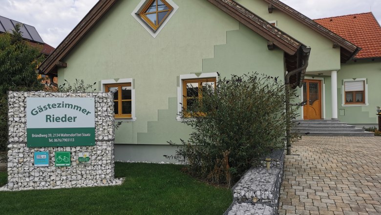 Guest room Rieder, © Fam. Rieder Green house with 'Gästezimmer Rieder' sign in the front garden.
