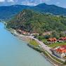 Aerial view of the Wachau with the Danube, hills and buildings.