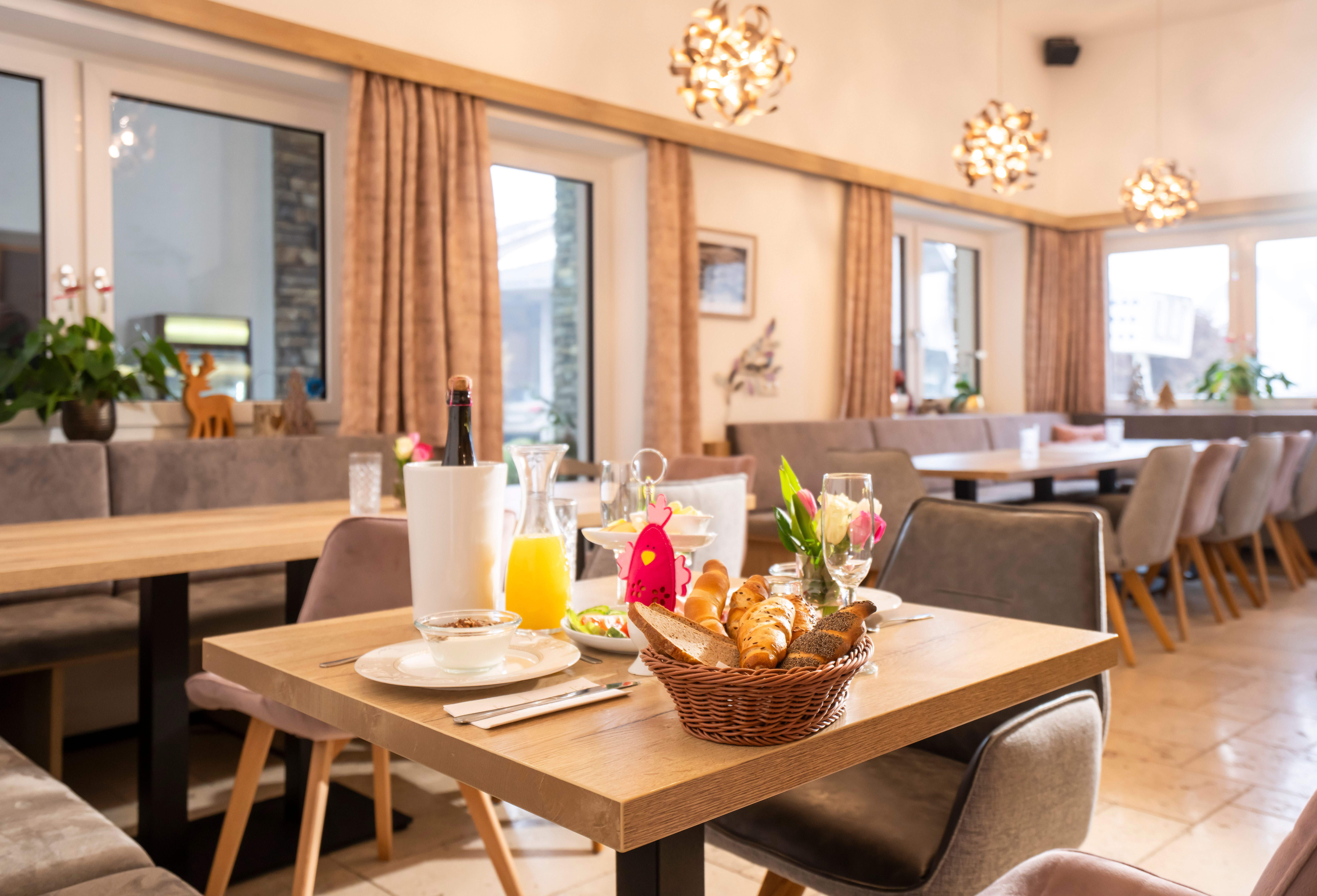 Richly laid breakfast table with products from our own production