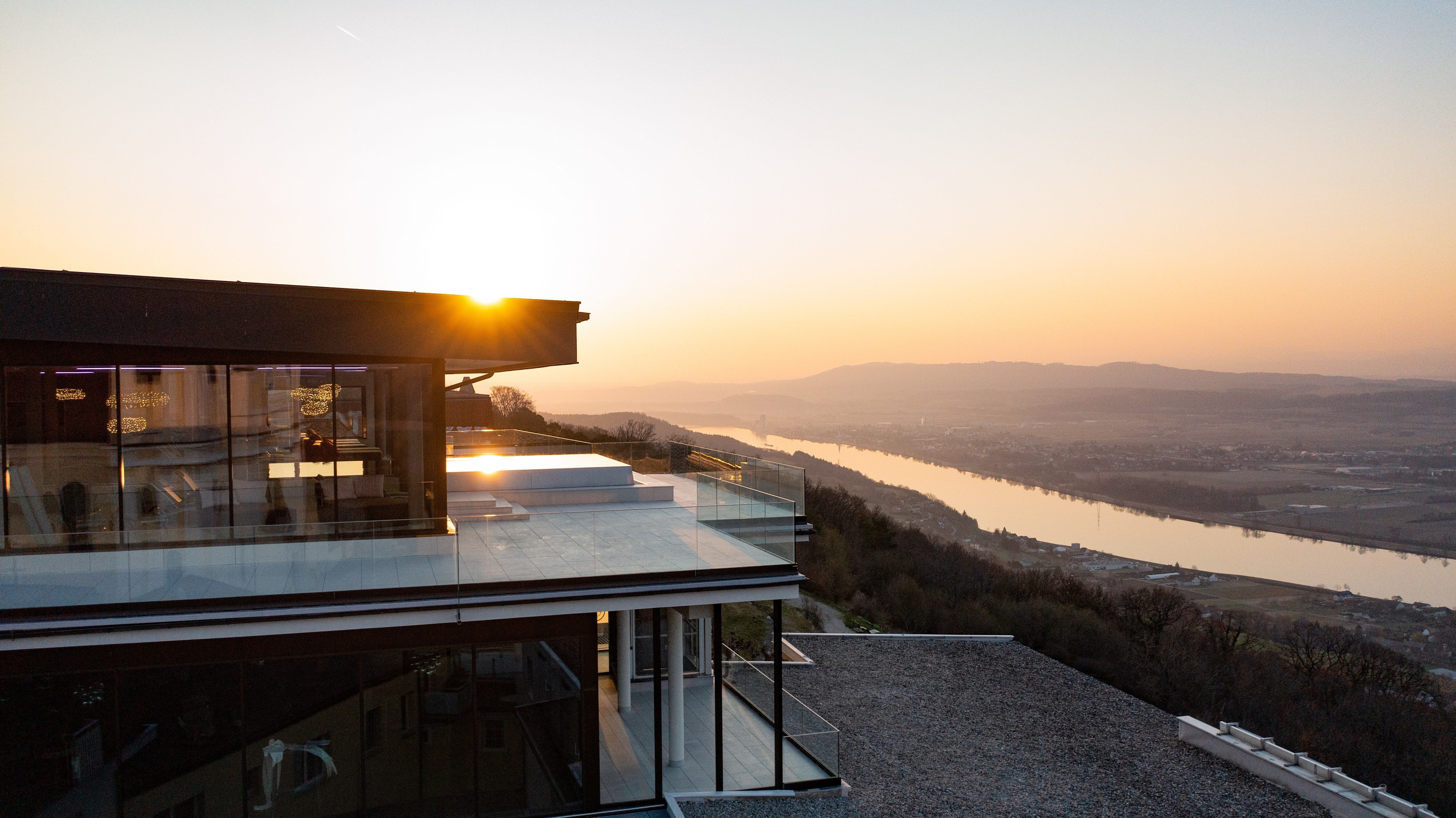 Infinity pool with views of the river and countryside.