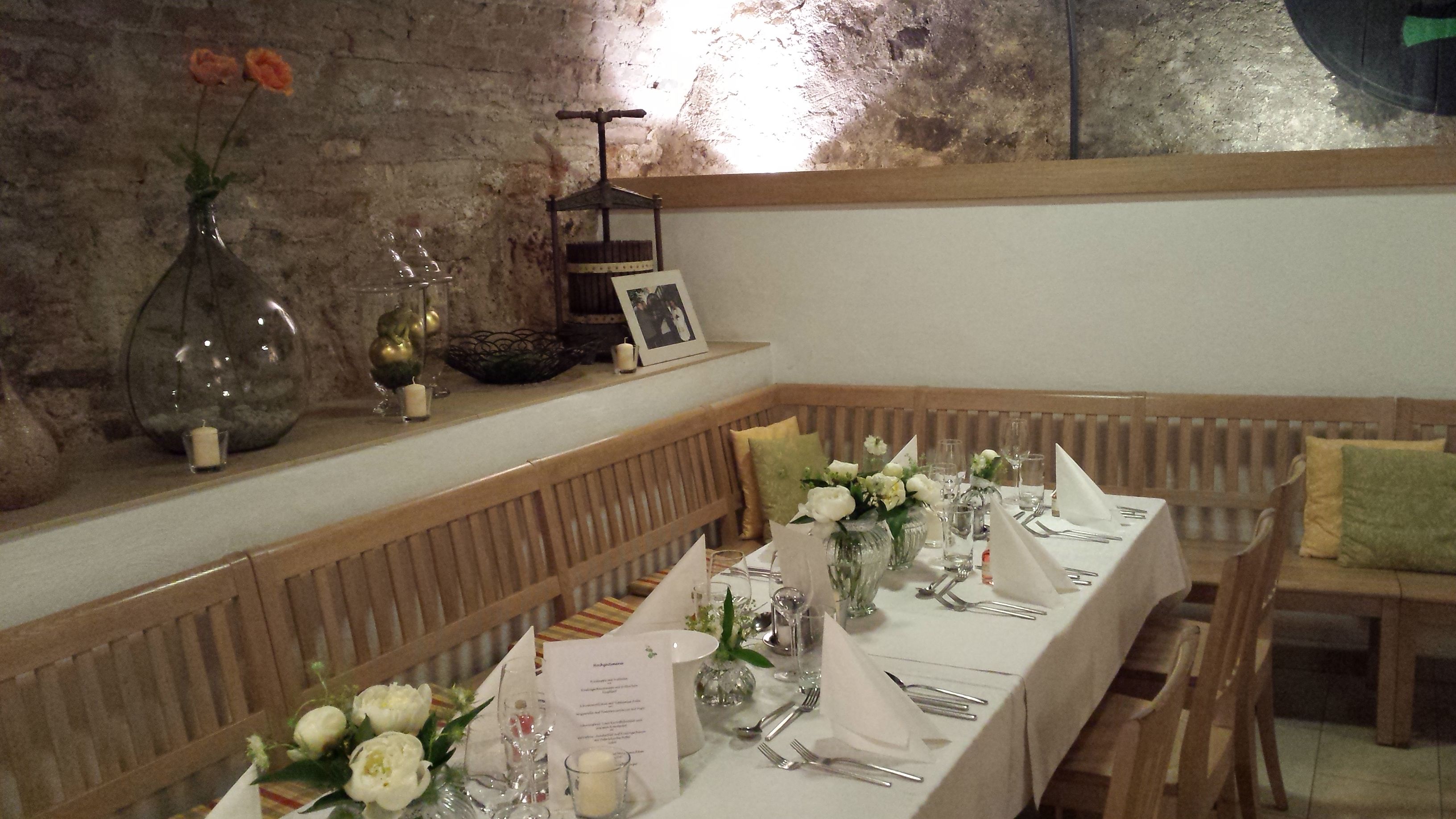 Cozy table setting in a rustic room with brick wall and decorations.