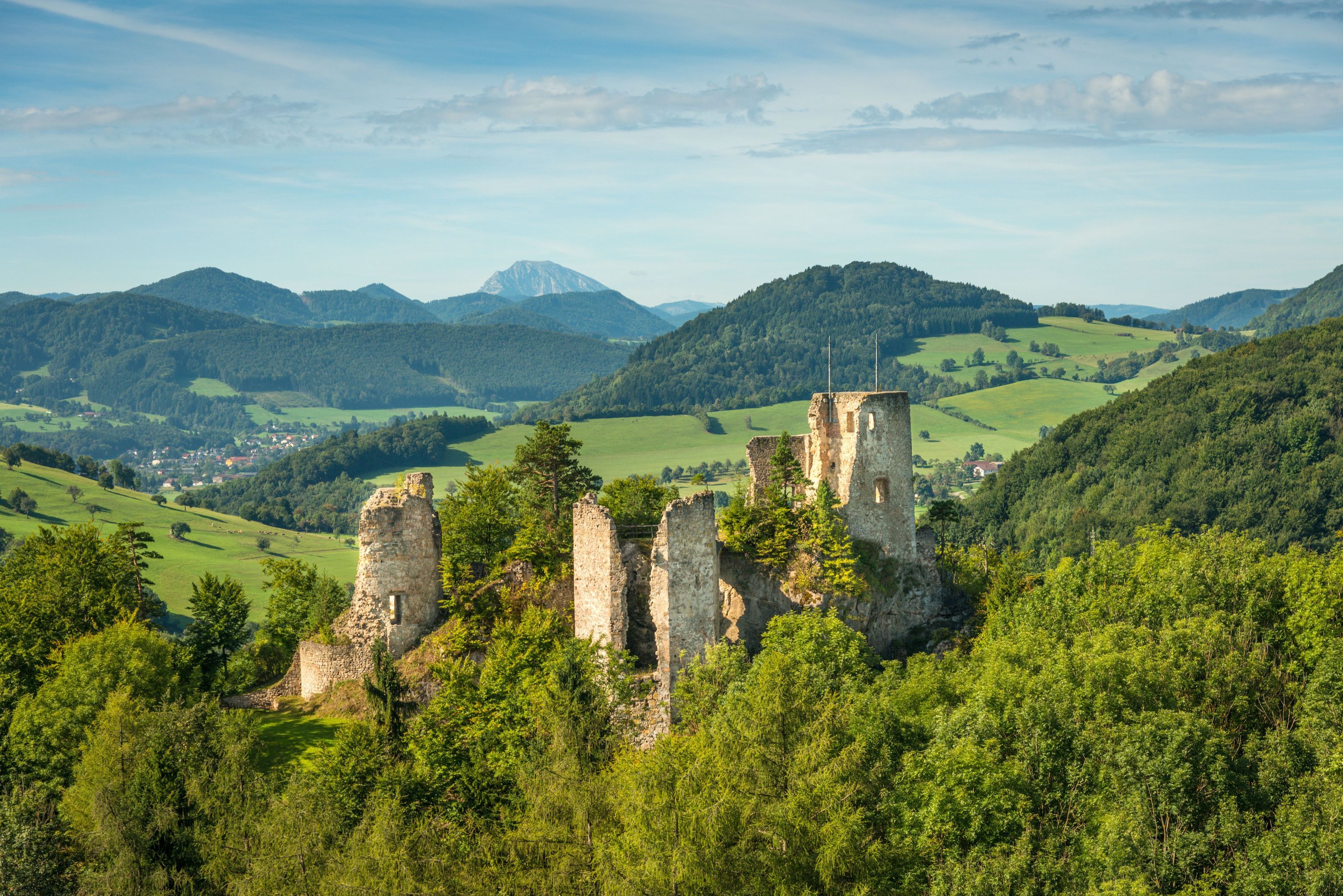 Rabenstein ruins amidst green hills and forests.