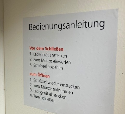 Instructions for an e-bike charging station with steps for closing and opening.