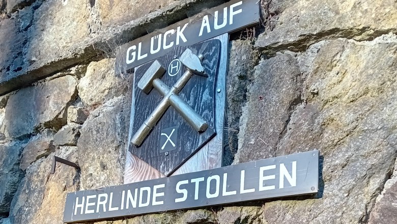 Entrance to the Herlinde gallery with mining sign and 'Glück Auf' lettering.
