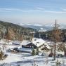 Winter landscape with mountain inn and ski lift in Mönichkirchen.
