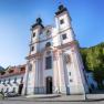Maria Schutz pilgrimage church with blue sky and green trees in the background.