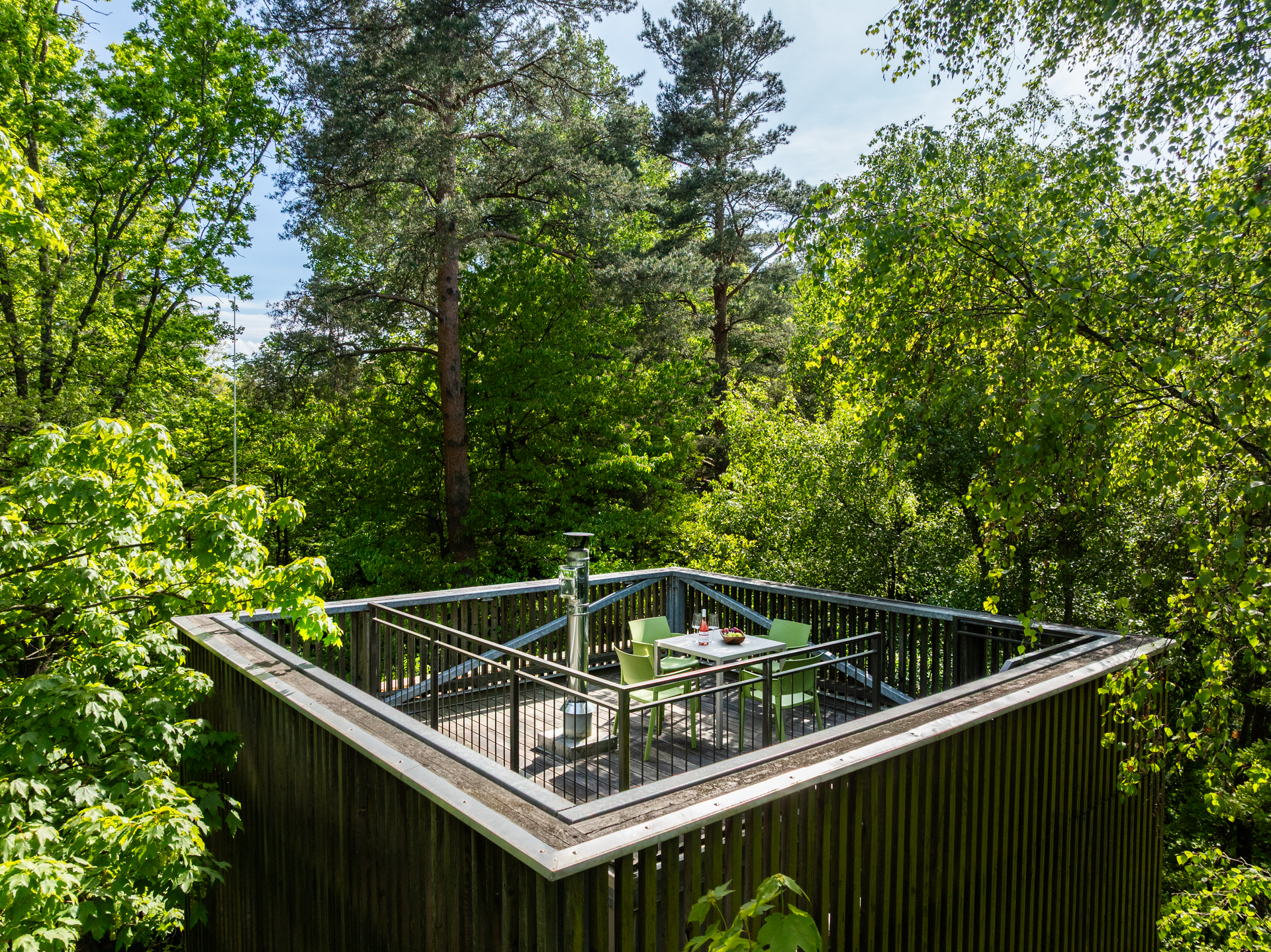 Tree house with terrace in a forest.