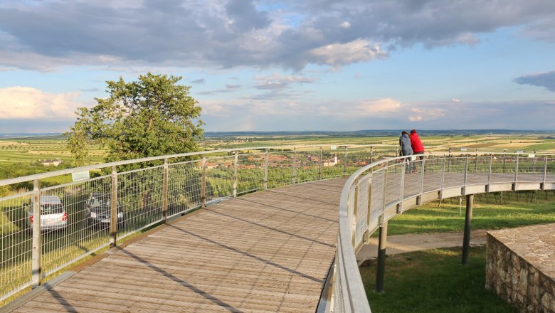 Viewing platform with two people looking at the landscape.