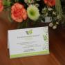 Welcome card of the Gartenappartement Ybbs on a table with flowers.