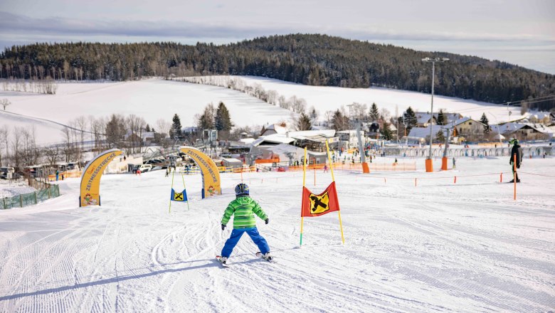 Child skiing in the family ski area of the Wexl Arena, St. Corona am Wechsel.