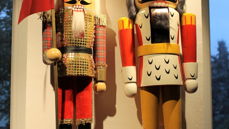Two large, decorative nutcracker figures in one room.