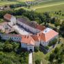 Aerial view of Mailberg Castle with surrounding landscape.