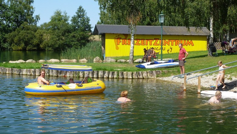 People enjoy leisure activities at Bergwerksee Langau.