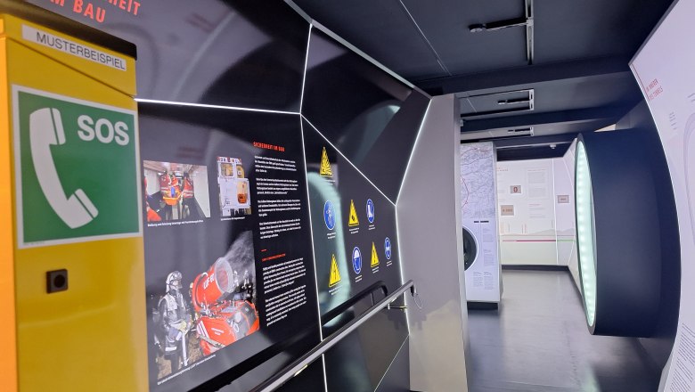 Exhibition on safety in construction with SOS telephone and information boards.